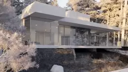 A wireframe image showing the design of a modern house nestled in a forest,