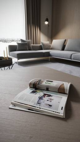 Close-up 3D render of an opened magazine on a coffee table, with a warmly lit sofa in the background, by CG VIZ Studio.